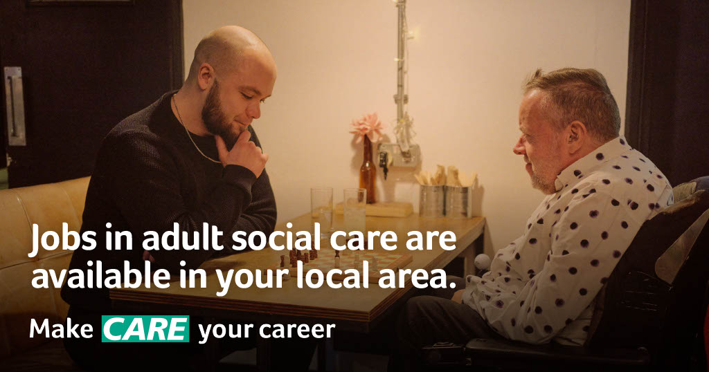 Care worker playing chess with a man, with the text 'jobs in adult social care are available in your local area.' and the make care your career logo underneath.